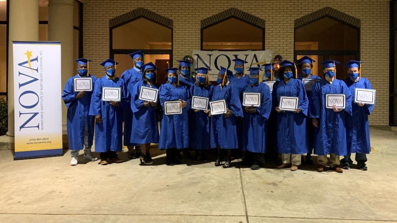 NOVA graduates gathered in blue caps and gowns