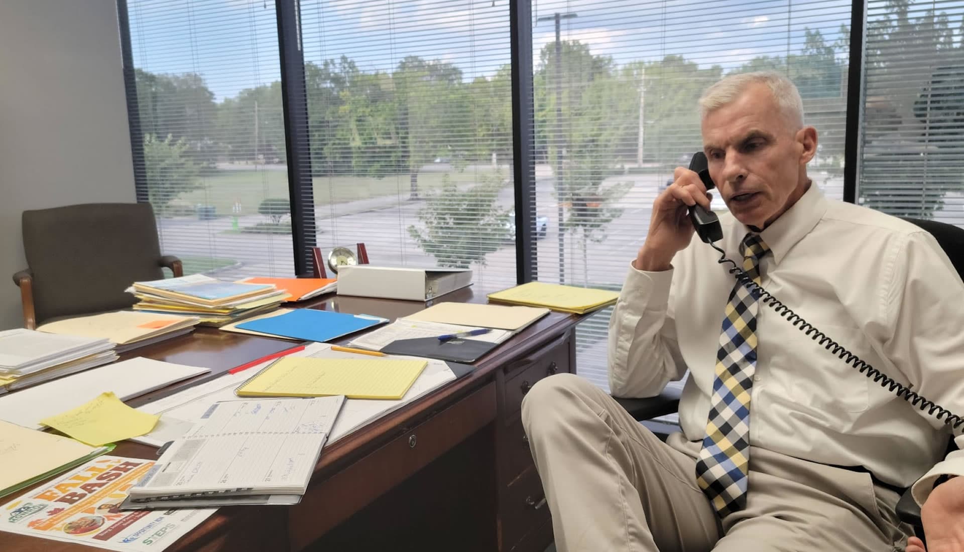 Paul West, Executive Director of NOVA, speaking on the phone in his office