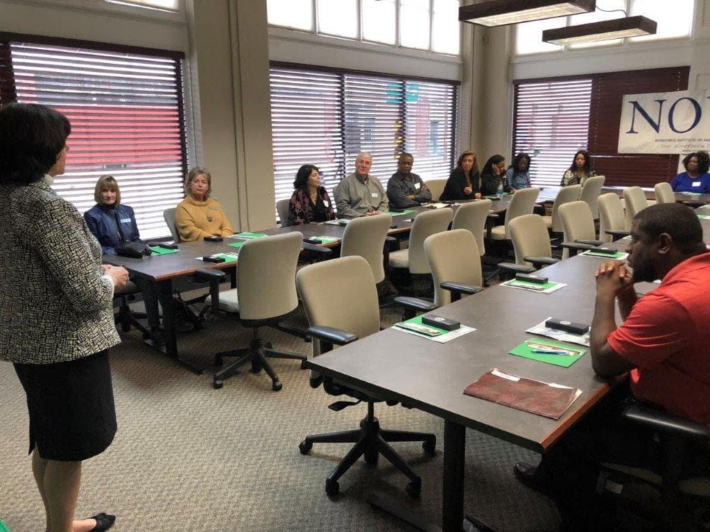 NOVA Advisory Council members meeting around a conference table
